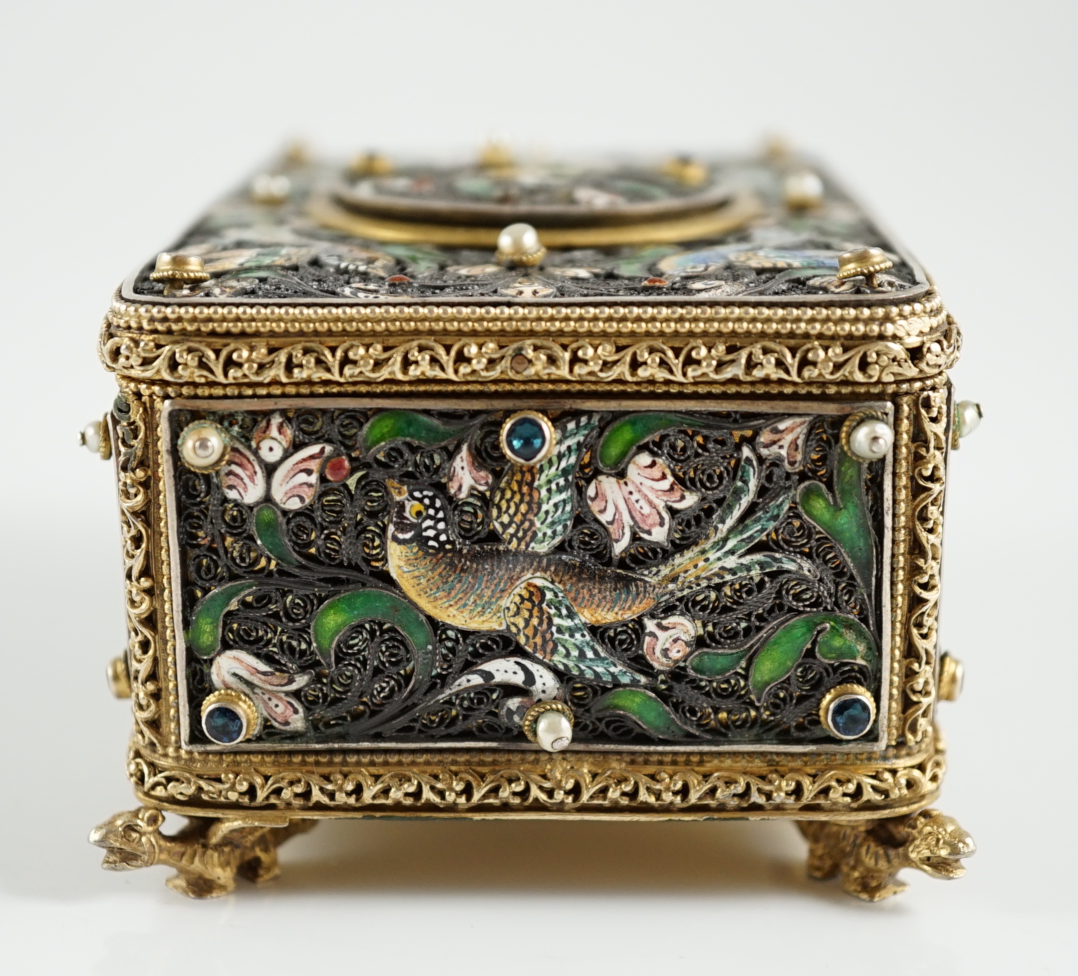 A 19th century Austro-Hungarian 800 standard silver gilt, jewelled and enamelled rectangular singing bird box automaton